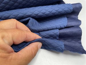 Quiltet jersey - marine med svage tern
